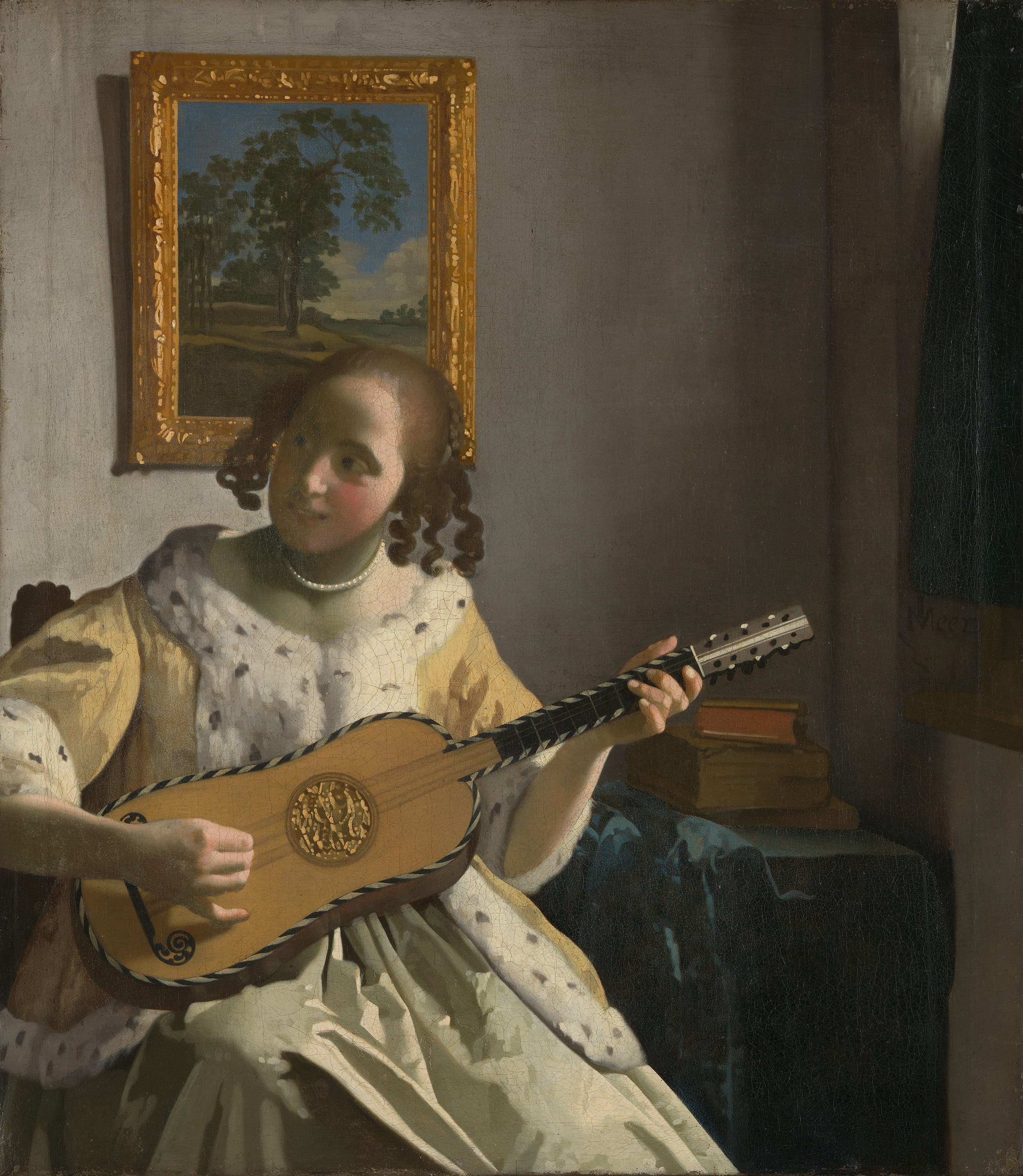 Young Woman Playing a Guitar