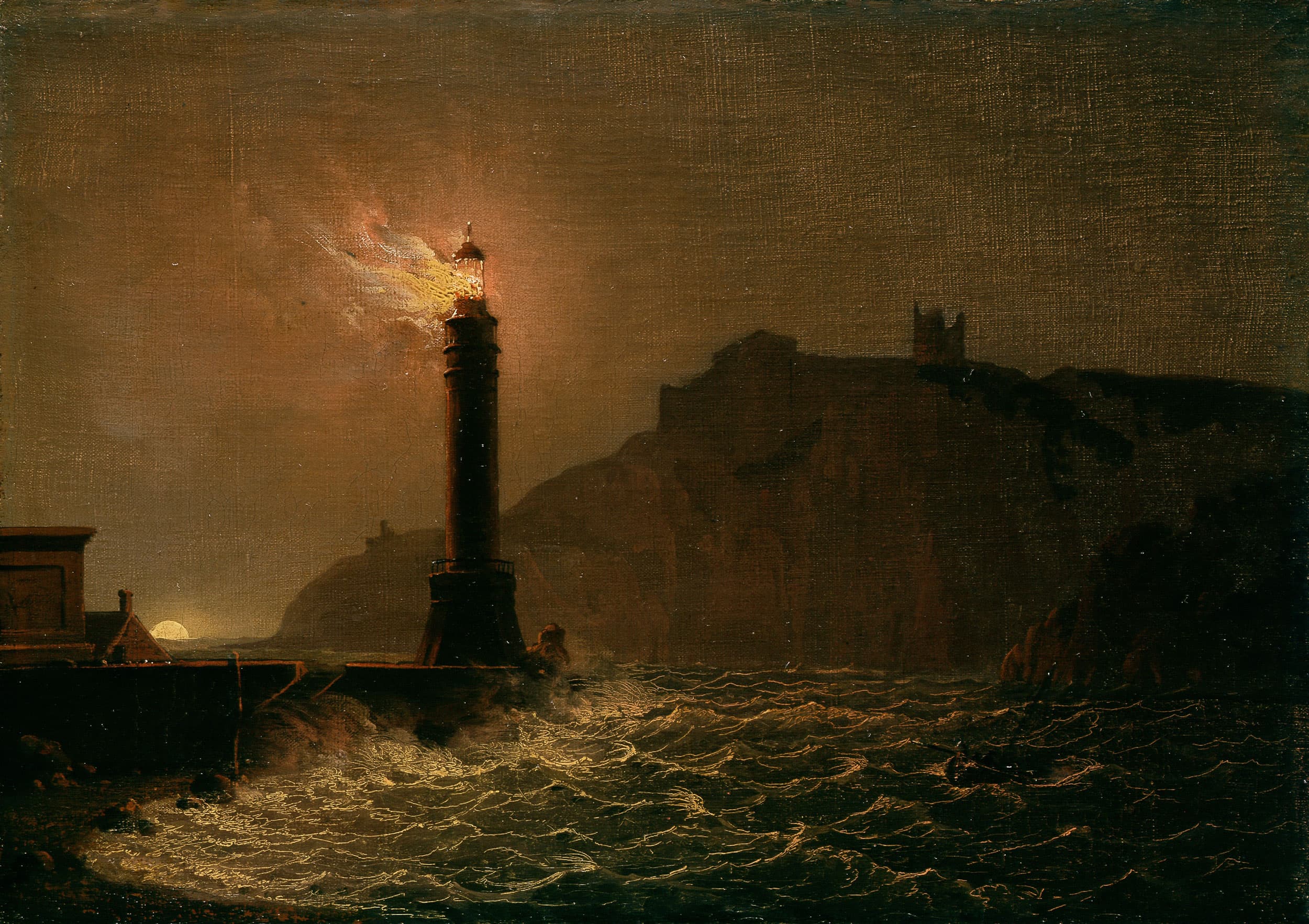 A lighthouse on fire at night