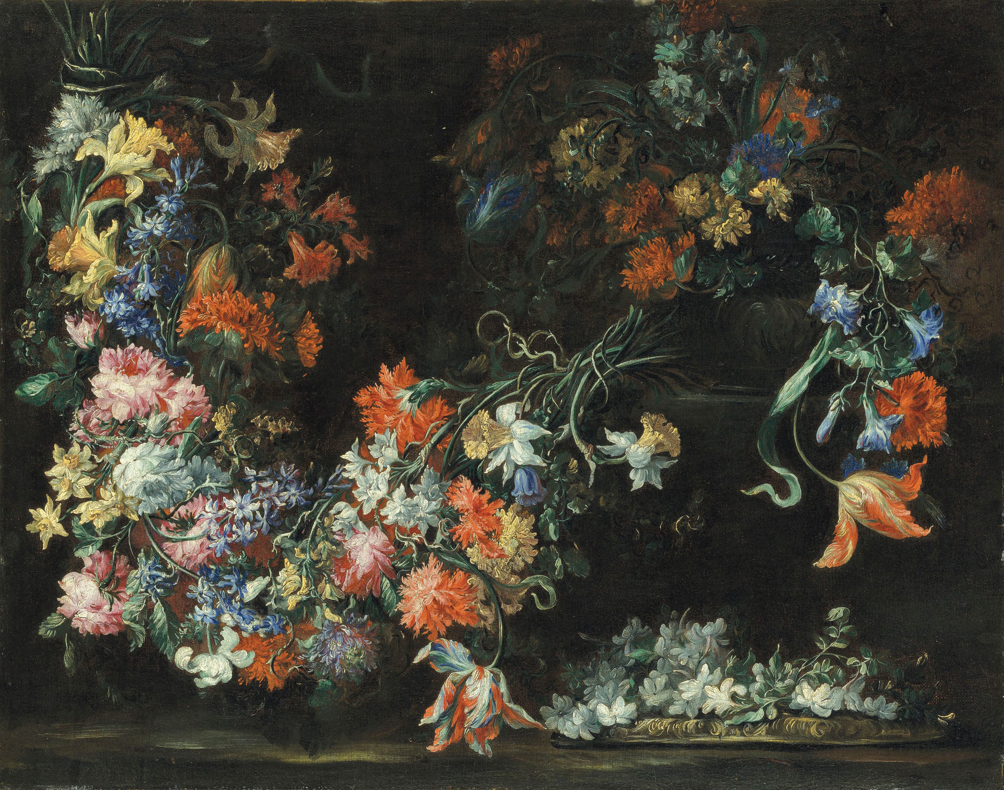 Swathes of flowers in urns on a ledge