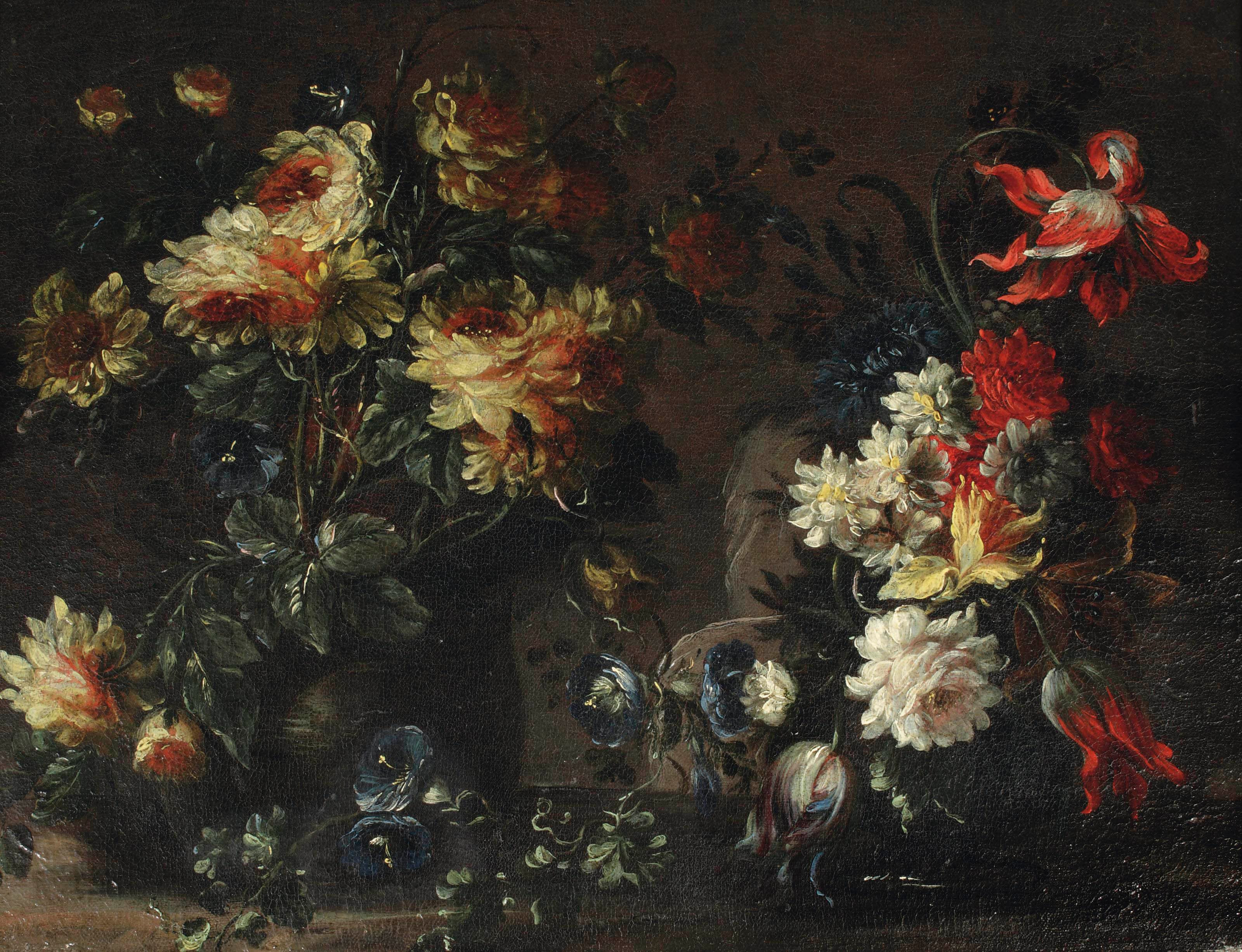 Tulips, roses and other flowers in two vases on a ledge